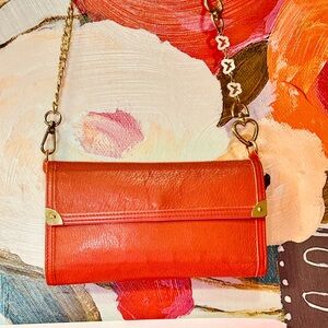 Louis Vuitton Vibrant Red Clutch with Gold Accents